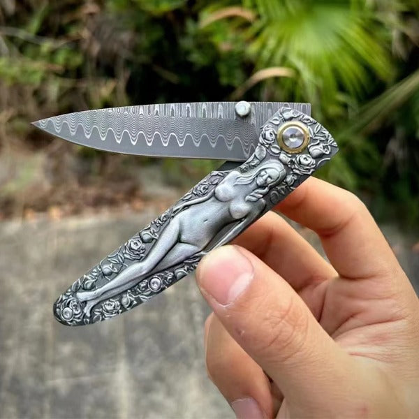 Vintage Handle Folding Knife Featuring a Damascus Steel Blade